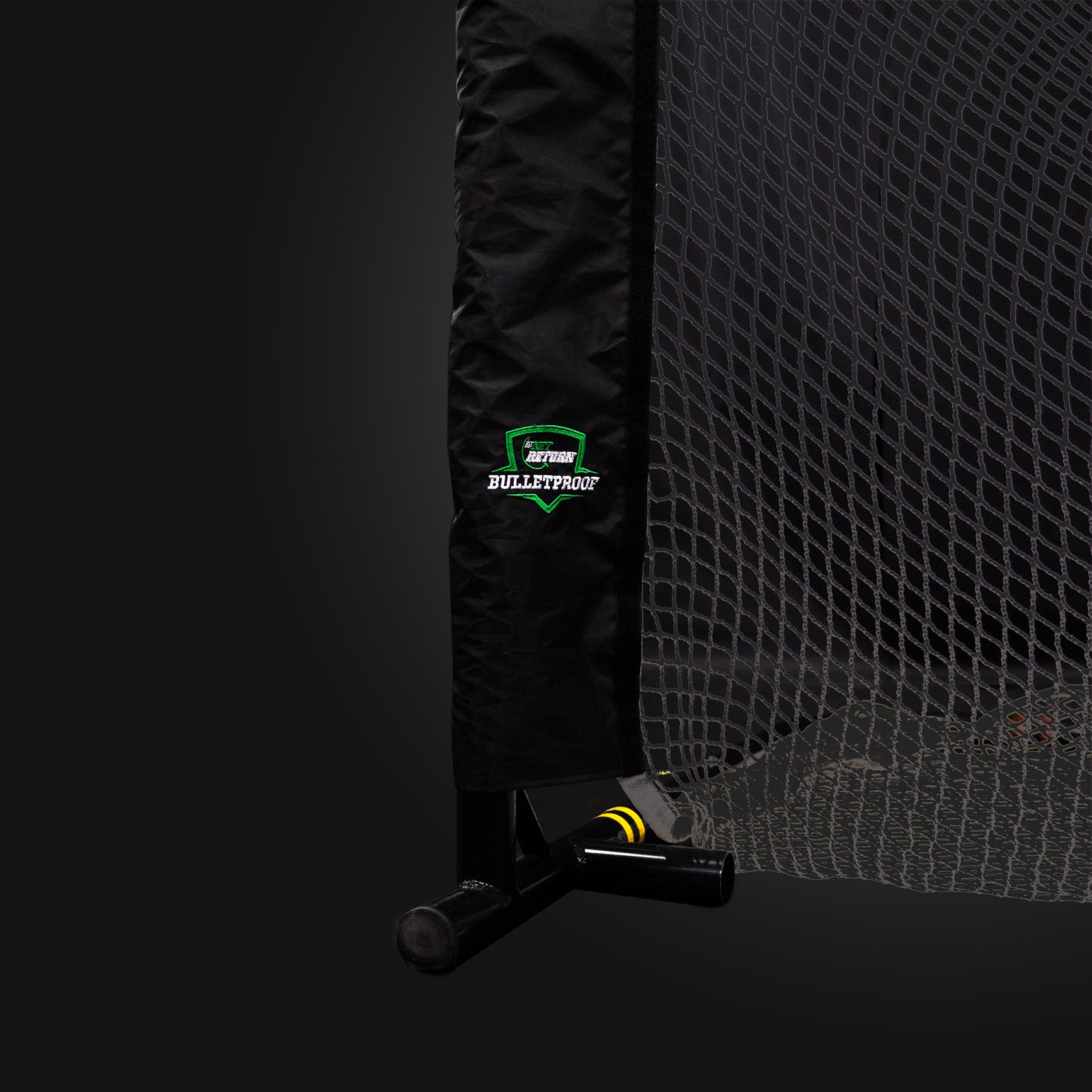 A protective net with a black padded post labeled "Bulletproof" on a dark background.