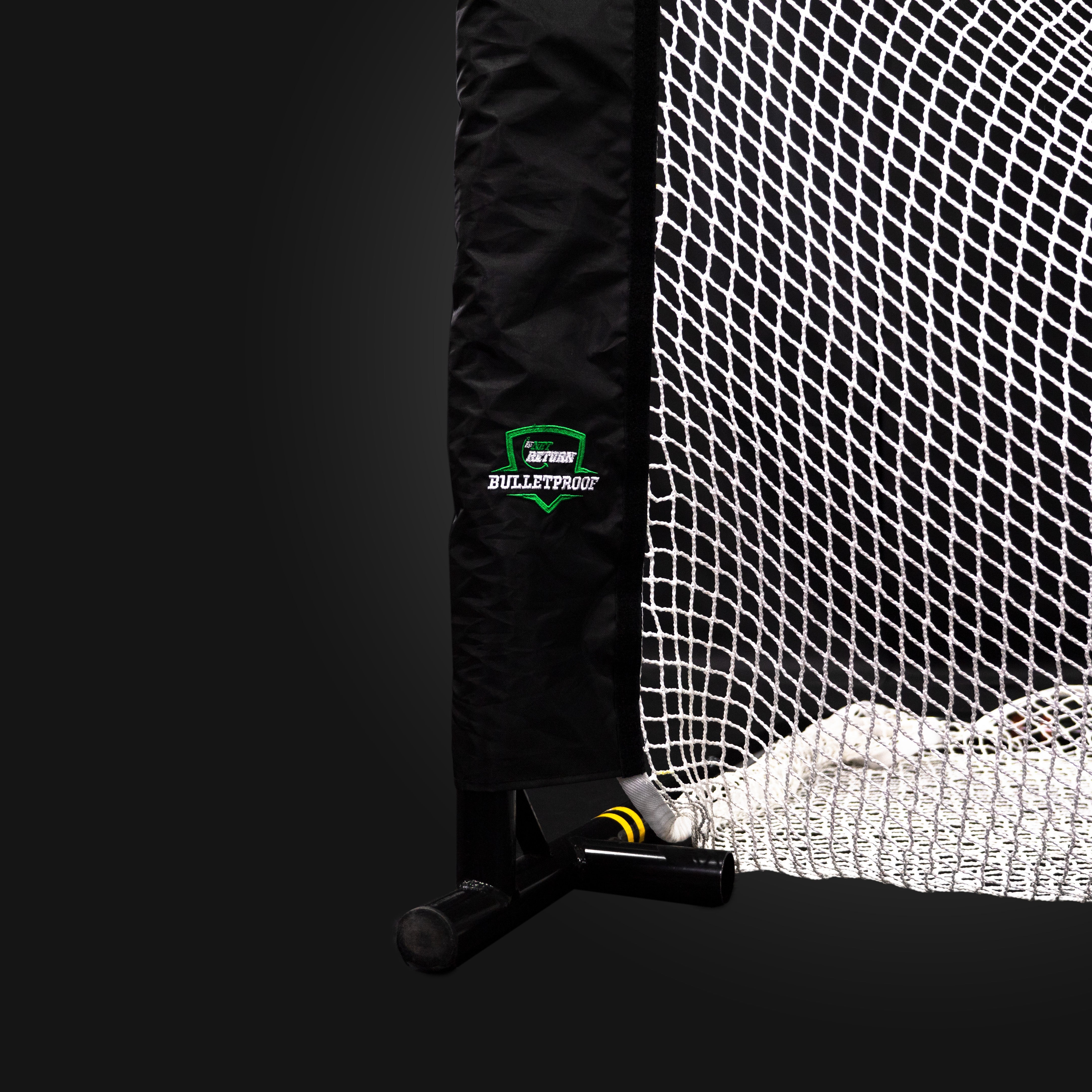 Close-up of a corner of a sports net with a black cover and the text "Bulletproof" on it. The net is on a black background.