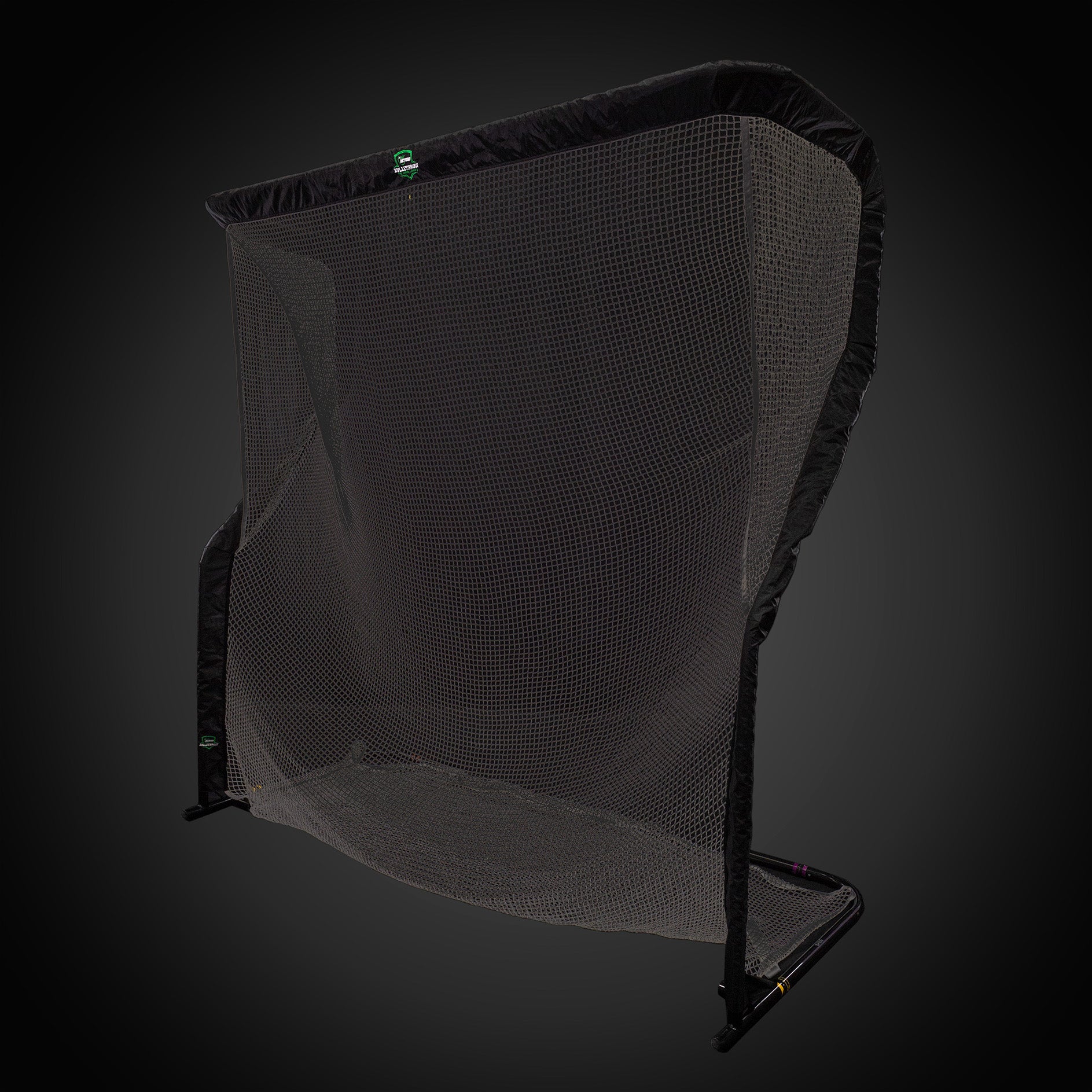 A black practice golf net with a sturdy frame against a dark background.