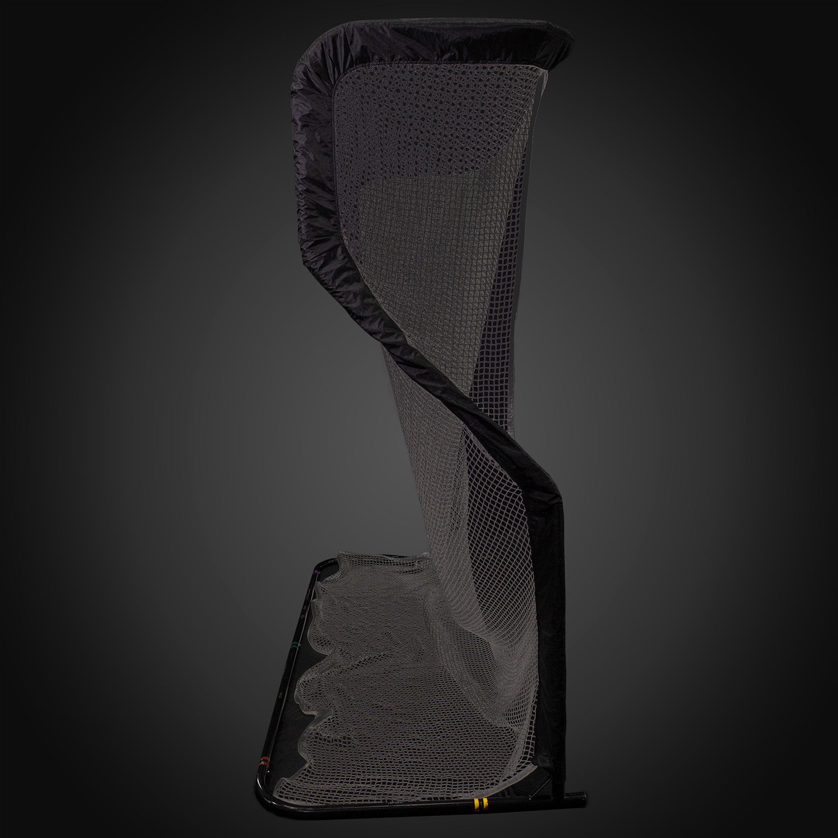 A tall, vertical black netting structure with a curved top, set against a dark background.