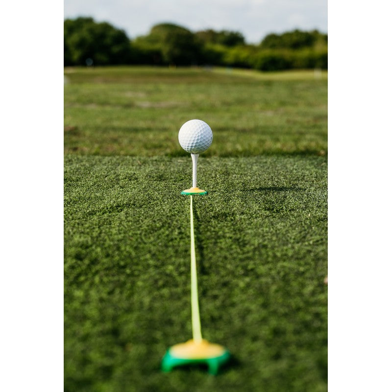 Tee Claw turf tee anchors, black and yellow — basic setup on hitting mat