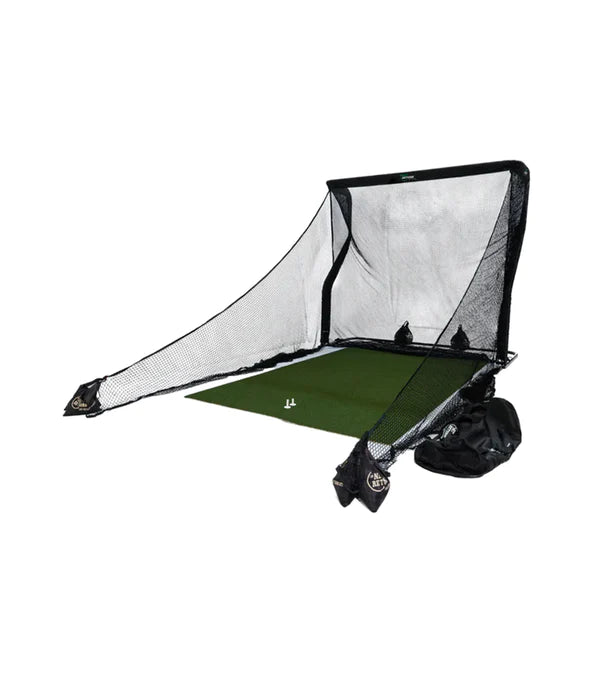 Golf practice net setup with a green mat and two golf balls on the mat.