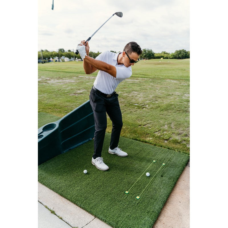 Tee Claw turf tee anchors, black and yellow — swing path drill with lanyard lines