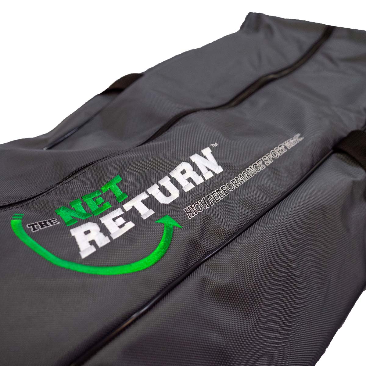 Close-up of a gray sports bag featuring the logo "The Net Return" with the tagline "High Performance Sports.
