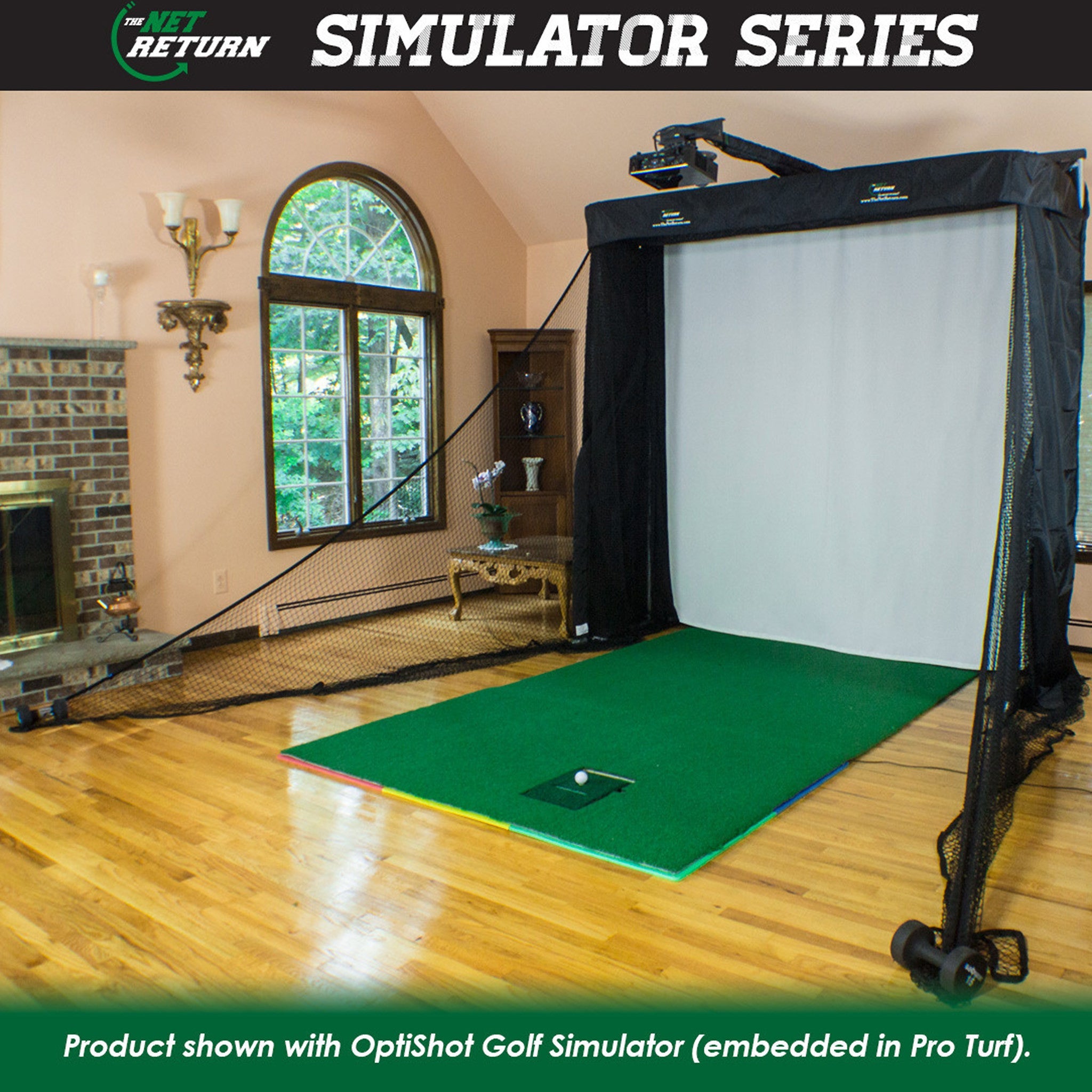 Indoor golf simulator setup with a net, green turf, and projector in a living room with hardwood floors and large windows.