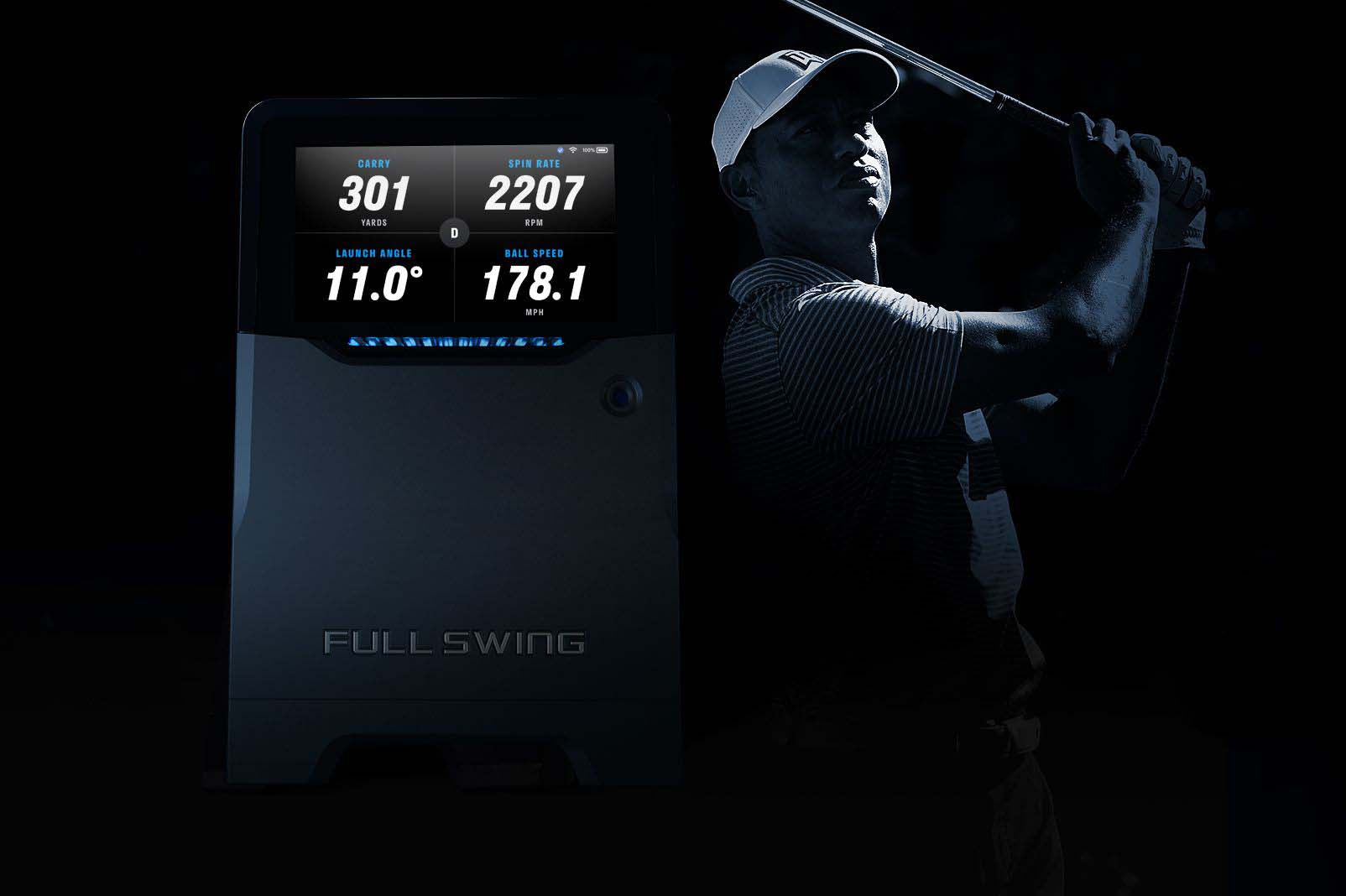 A golfer is taking a swing beside the Full Swing monitor displaying stats: Carry 301, Spin Rate 2207, Launch Angle 11.0, Ball Speed 178.1.