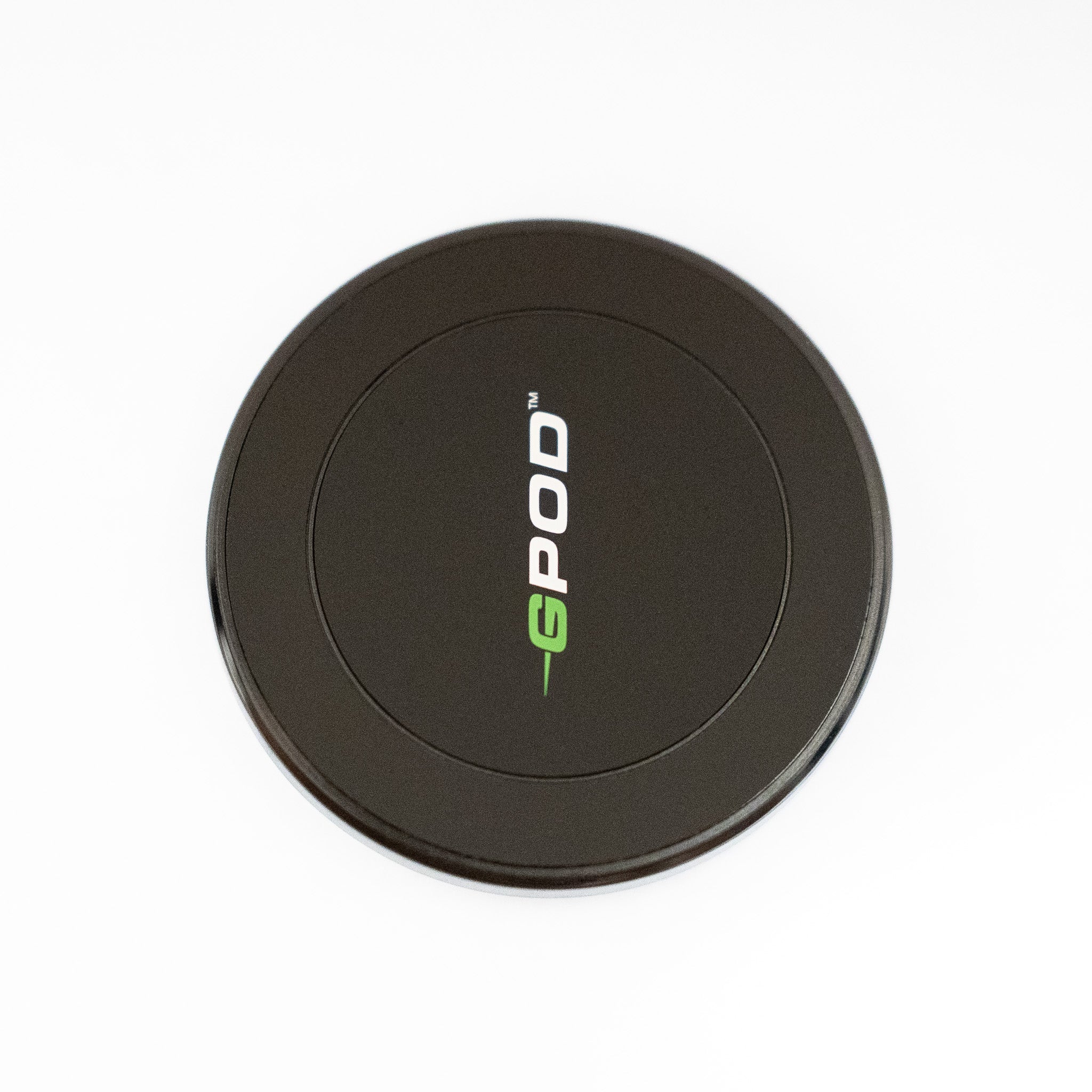 A round, black GPOD GOLF accessory with "GPOD" in white and green letters is shown on a white background—perfect for swing analysis when paired with your GPOD Travel + Sportsbox 3D Player Annual.