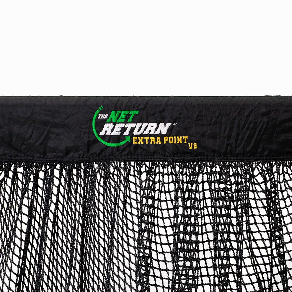 Close-up of a black sports net with the text "The Net Return Extra Point V2" printed on the top band.