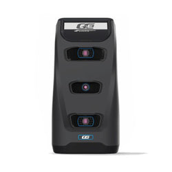 A black electronic device with three circular lenses and a display panel on top, labeled "GE.