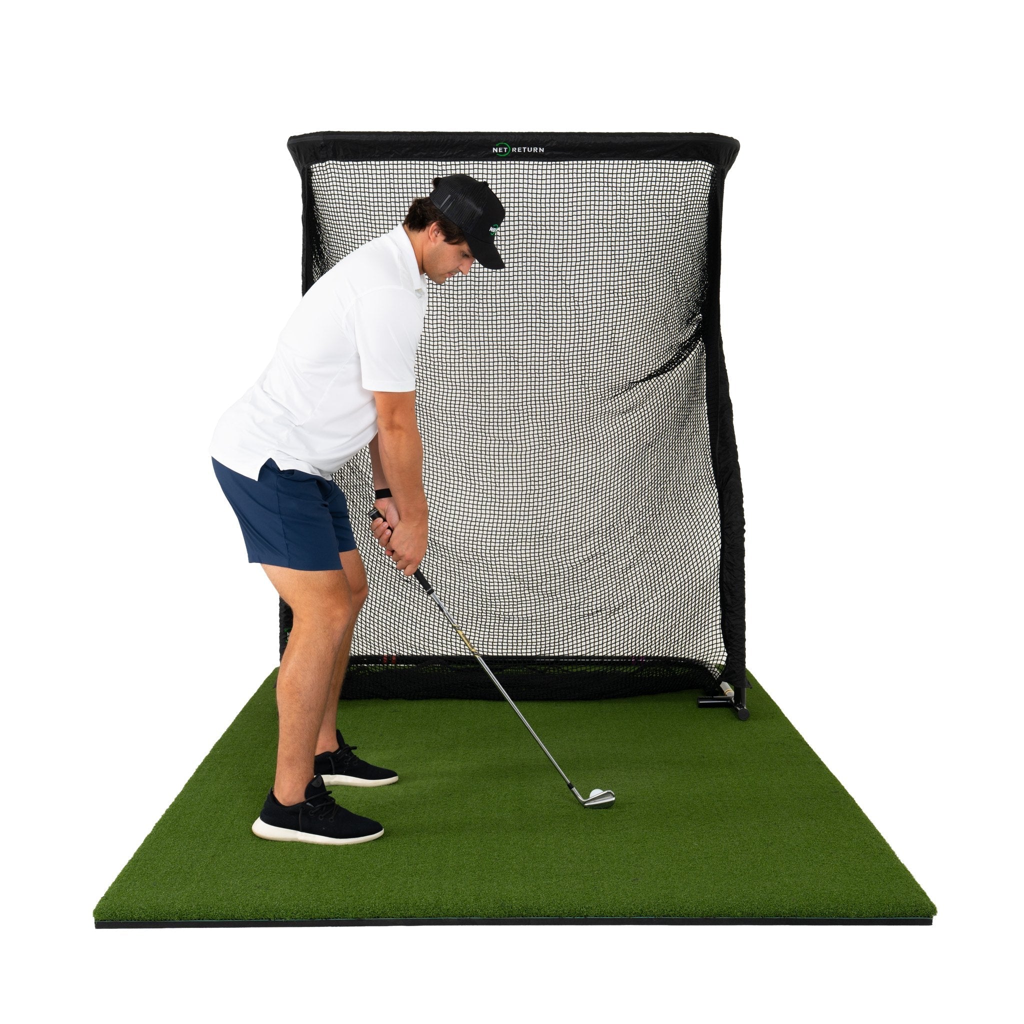 The Net Return Mini Pro golf net with turf, front view (lifestyle)